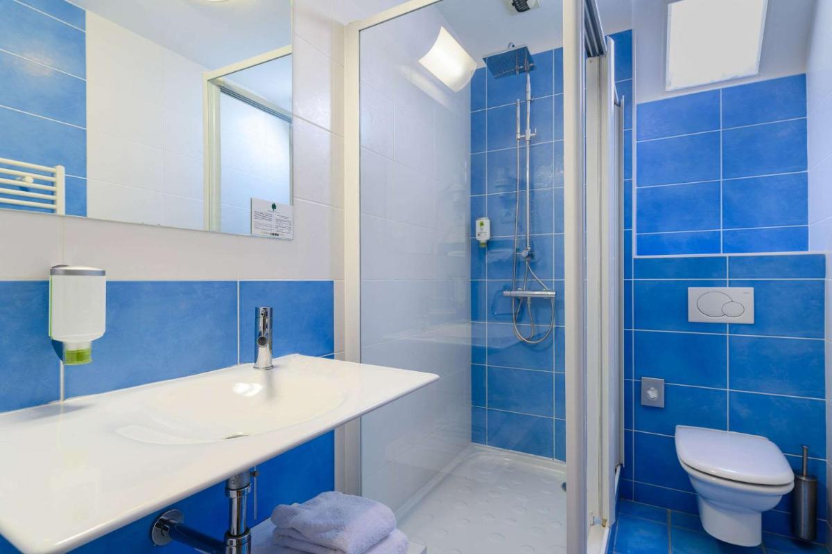 Salle de bains dans l'établissement The Originals Boutique, Hôtel La Marébaudière, Vannes
