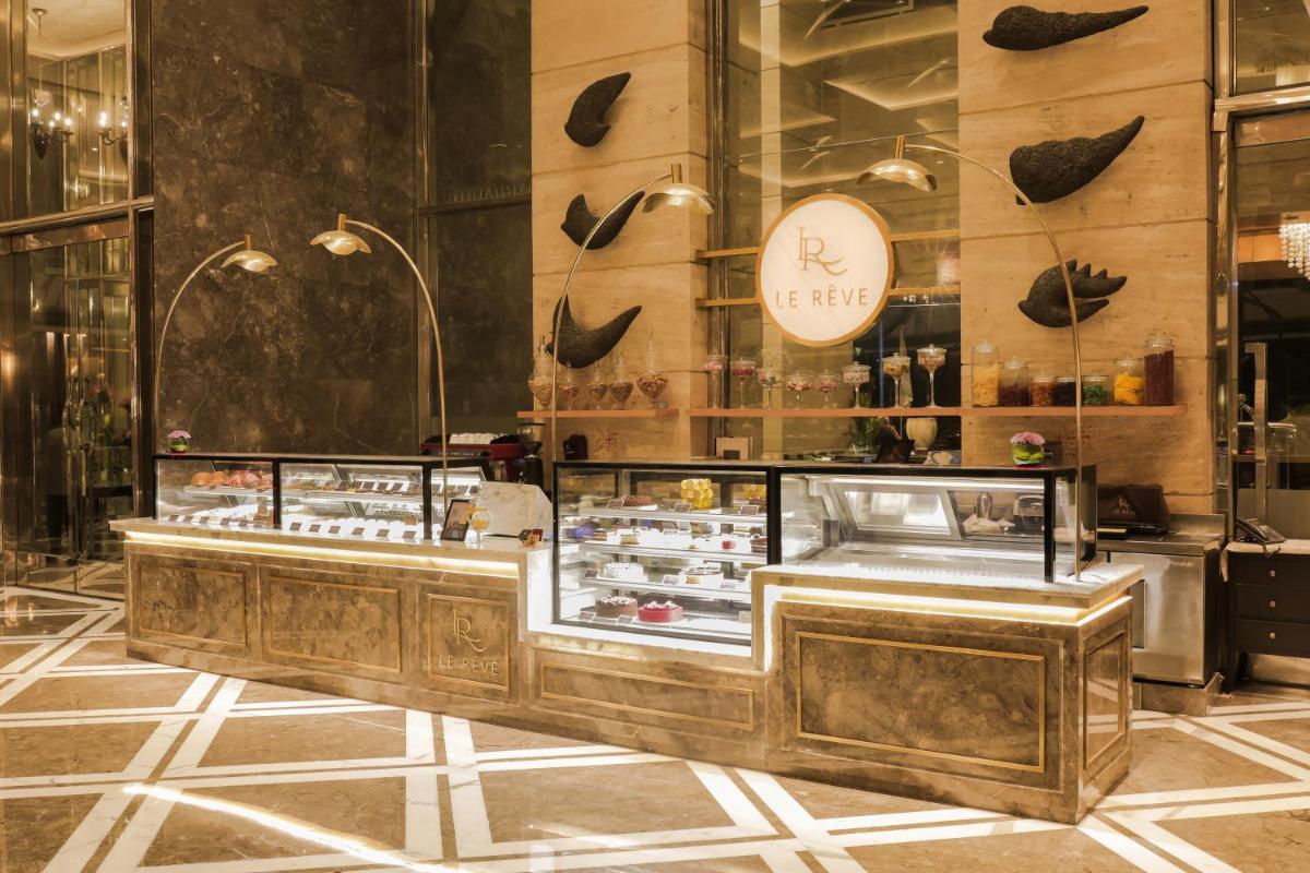 a bakery with a display case in a store at The Leela Ambience Gurugram Hotel & Residences - The Luxury Urban Sanctuary in Gurgaon