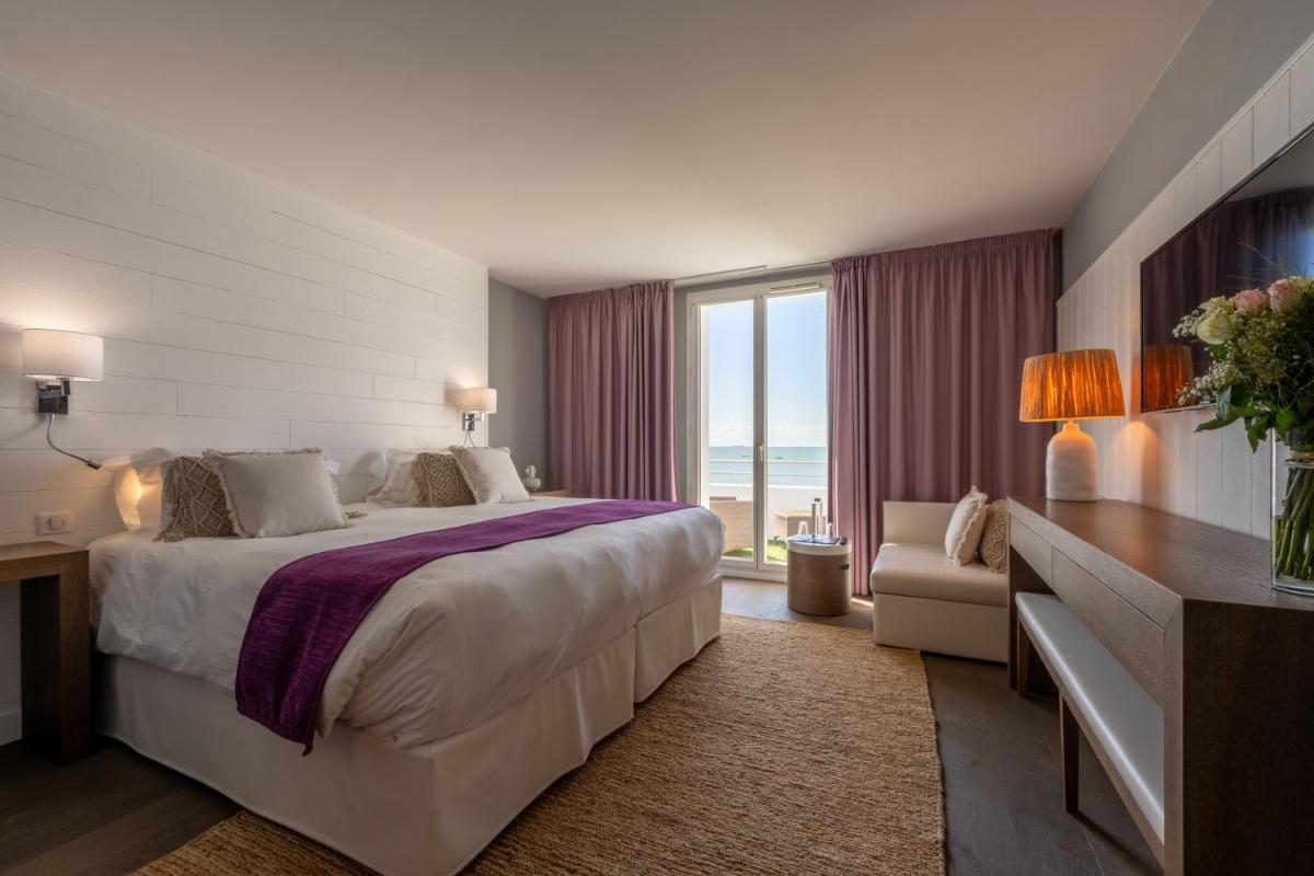 Un ou plusieurs lits dans un hébergement de l'établissement Hôtel Atalante - Relais Thalasso & Spa
