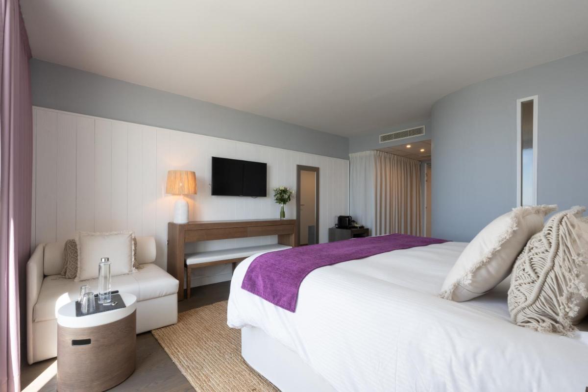 Un ou plusieurs lits dans un hébergement de l'établissement Hôtel Atalante - Relais Thalasso & Spa