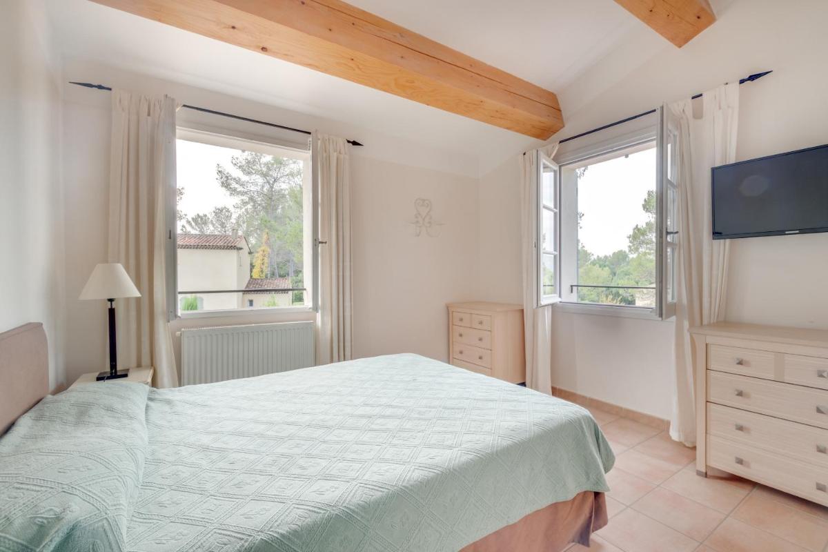 Un ou plusieurs lits dans un hébergement de l'établissement Les Appartements et Maisons du Domaine de Saint Endréol Golf & Spa Resort