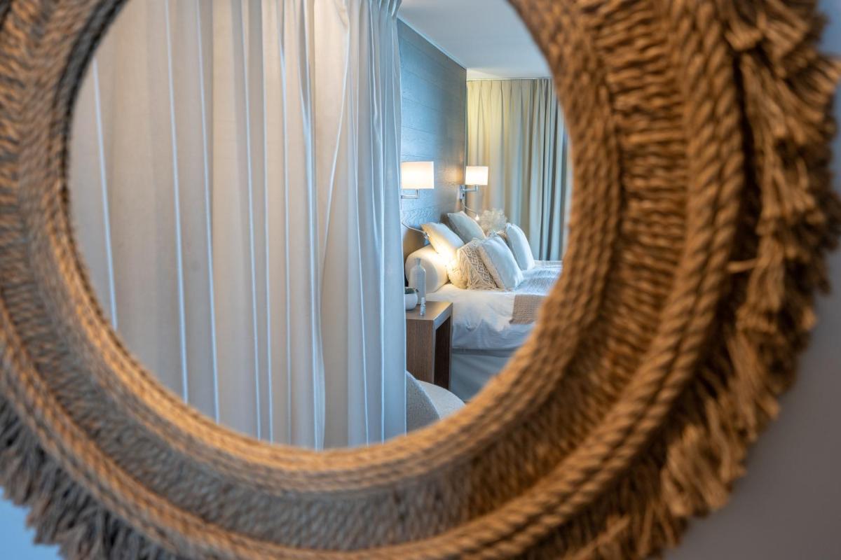 Un ou plusieurs lits dans un hébergement de l'établissement Hôtel Atalante - Relais Thalasso & Spa