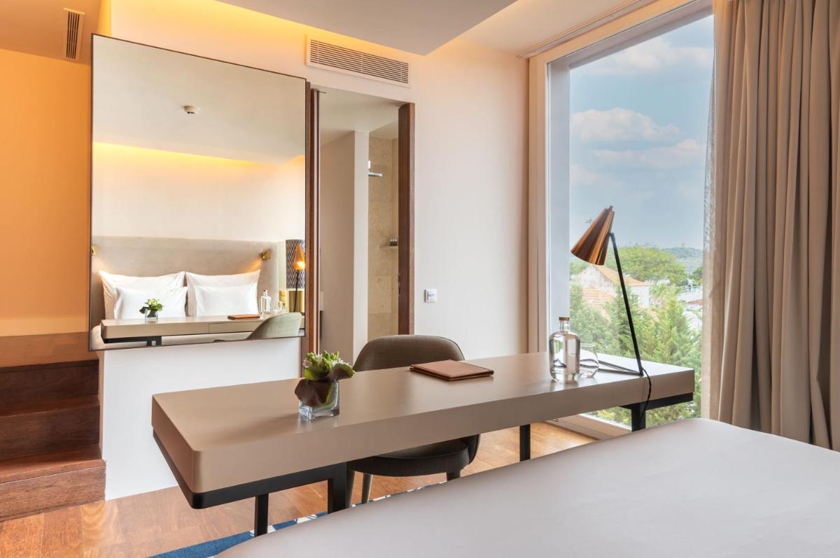 Uma cama ou camas num quarto em Palácio do Governador - Lisbon Hotel & Spa