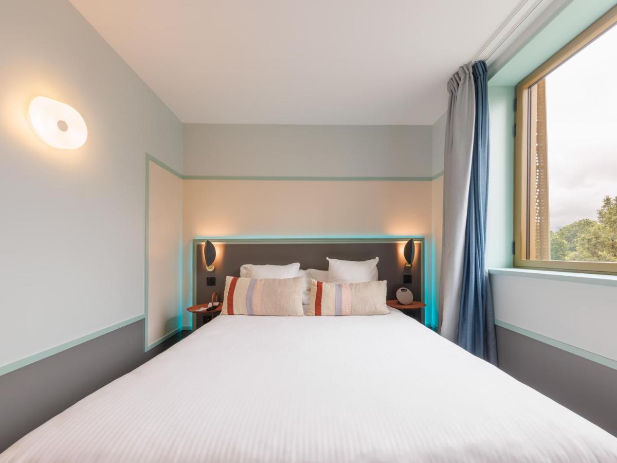 Un ou plusieurs lits dans un hébergement de l'établissement Aiden by Best Western Clermont-Ferrand Hotel & Spa