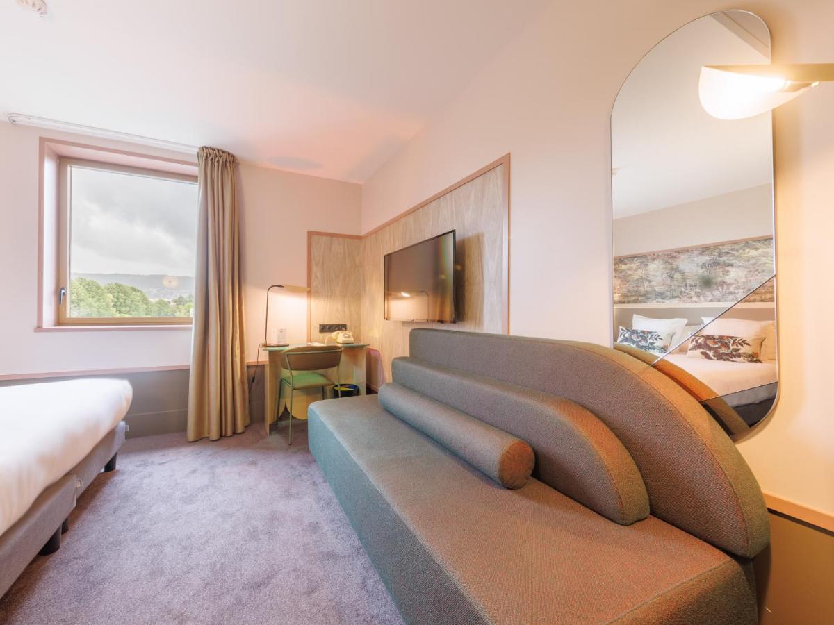 Un ou plusieurs lits dans un hébergement de l'établissement Aiden by Best Western Clermont-Ferrand Hotel & Spa