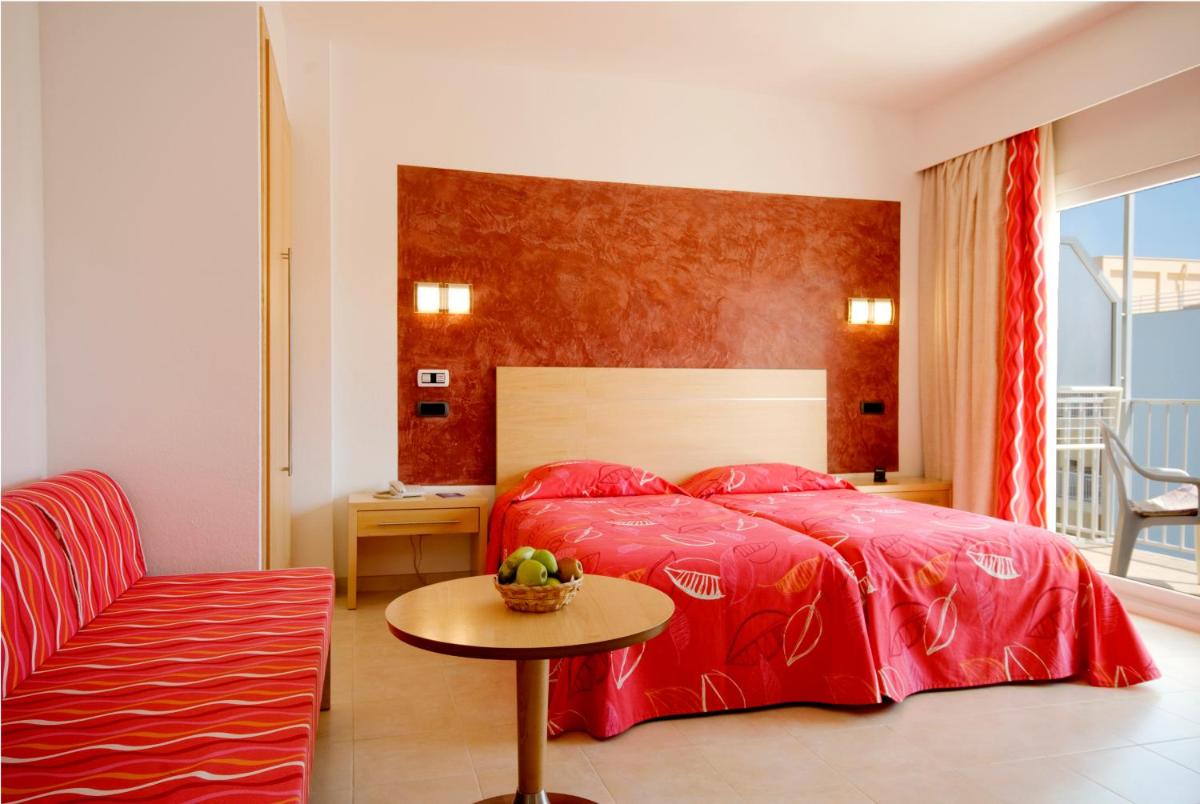 Cama o camas de una habitación en Hotel Capricho