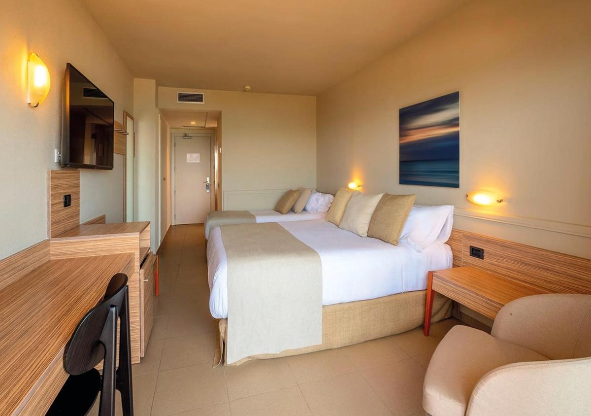 Cama o camas de una habitación en AQUA Hotel Promenade & Spa 4Sup