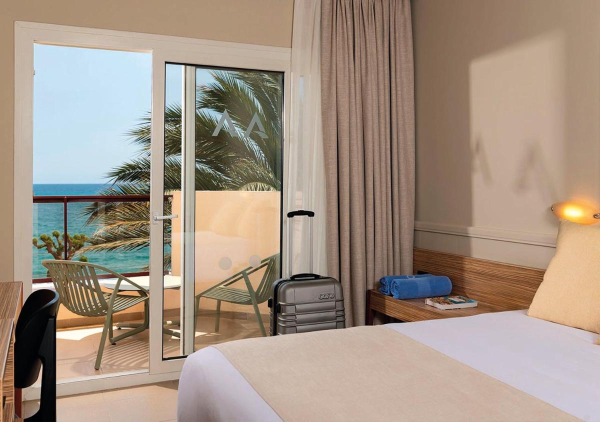 Cama o camas de una habitación en AQUA Hotel Promenade & Spa 4Sup