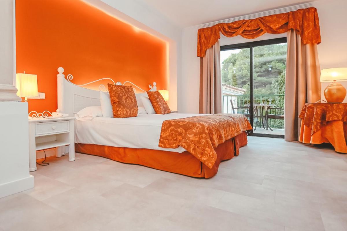 Cama o camas de una habitación en Lago Garden Apart-Suites & Spa Hotel