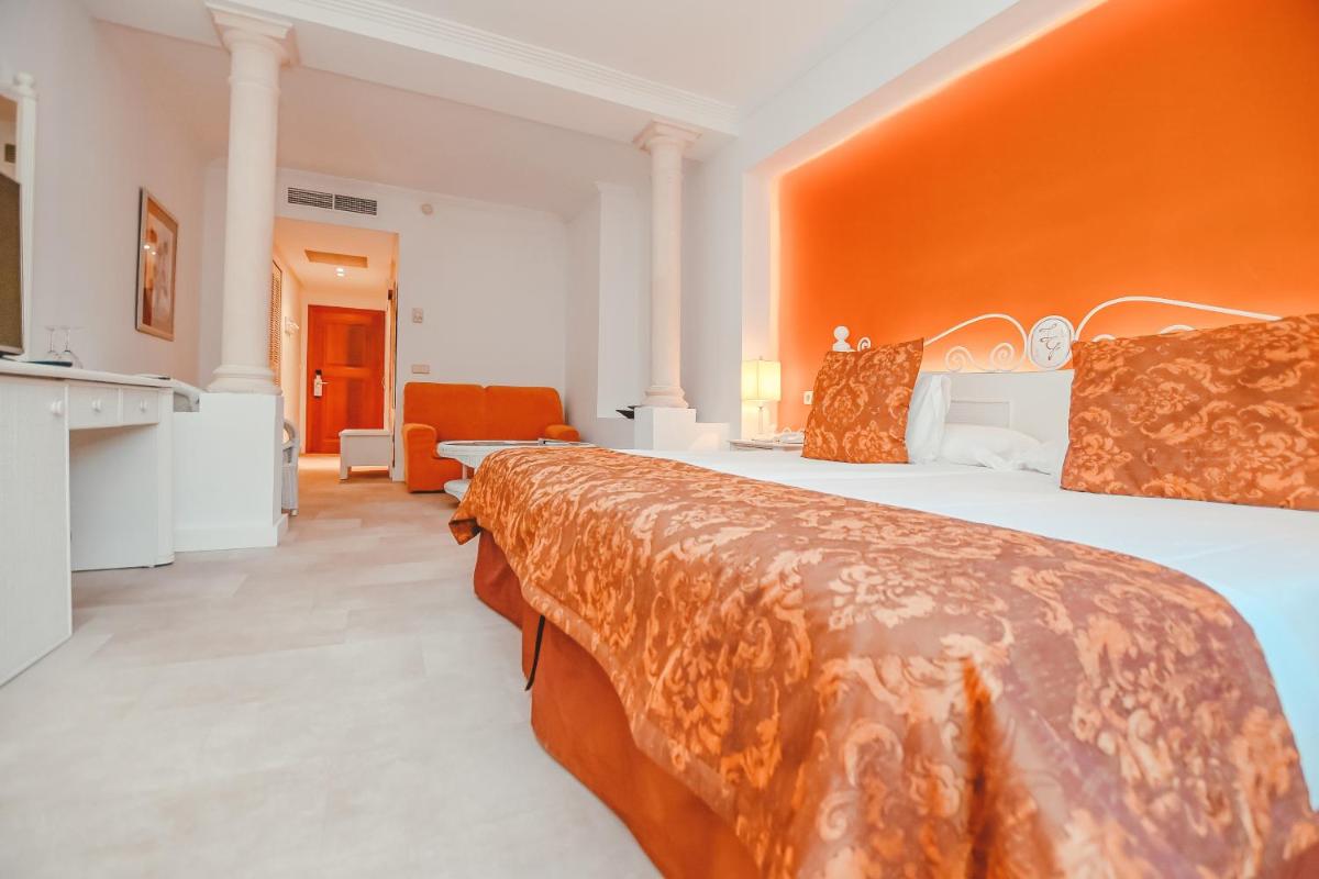 Cama o camas de una habitación en Lago Garden Apart-Suites & Spa Hotel