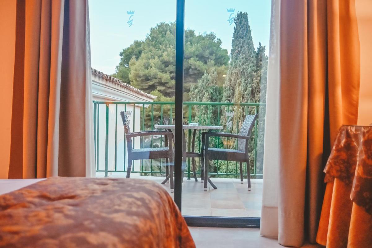 Un balcón o terraza de Lago Garden Apart-Suites & Spa Hotel