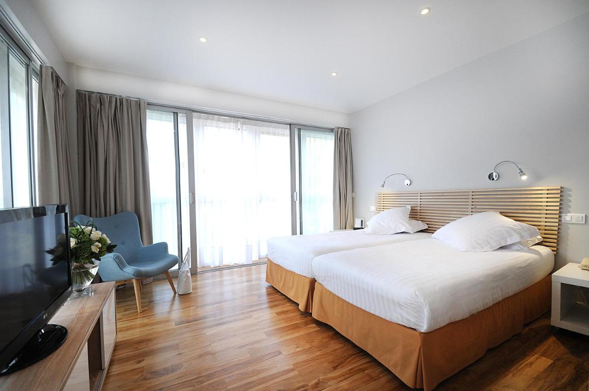 Un ou plusieurs lits dans un hébergement de l'établissement Splendid Hotel & Spa Nice