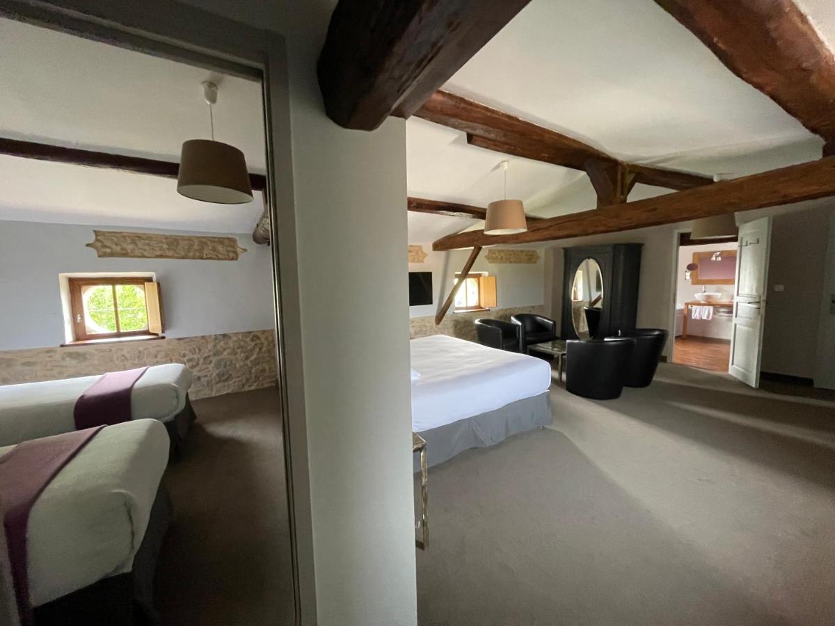 Un ou plusieurs lits dans un hébergement de l'établissement Logis Hôtel Château De Palaja