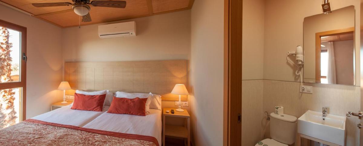 Cama o camas de una habitación en Magic Natura Resort