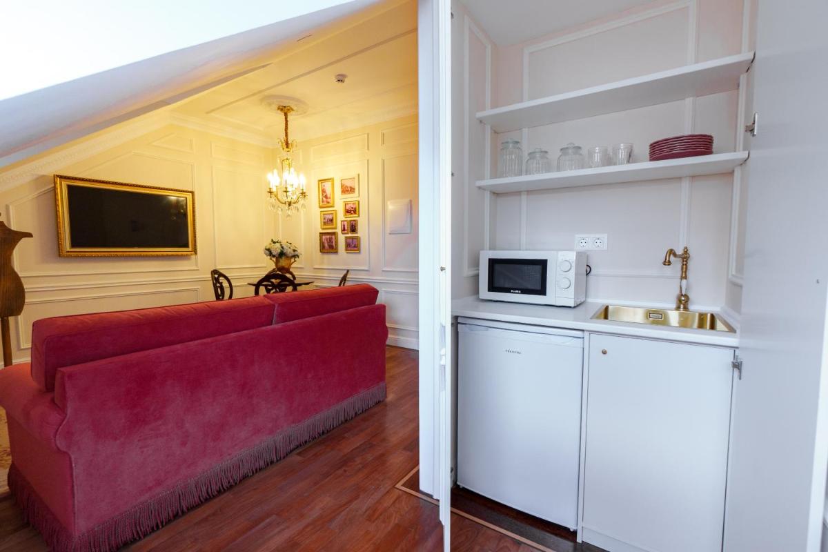 Uma televisão e/ou sistema de entretenimento em Boutique Hotel Teatro