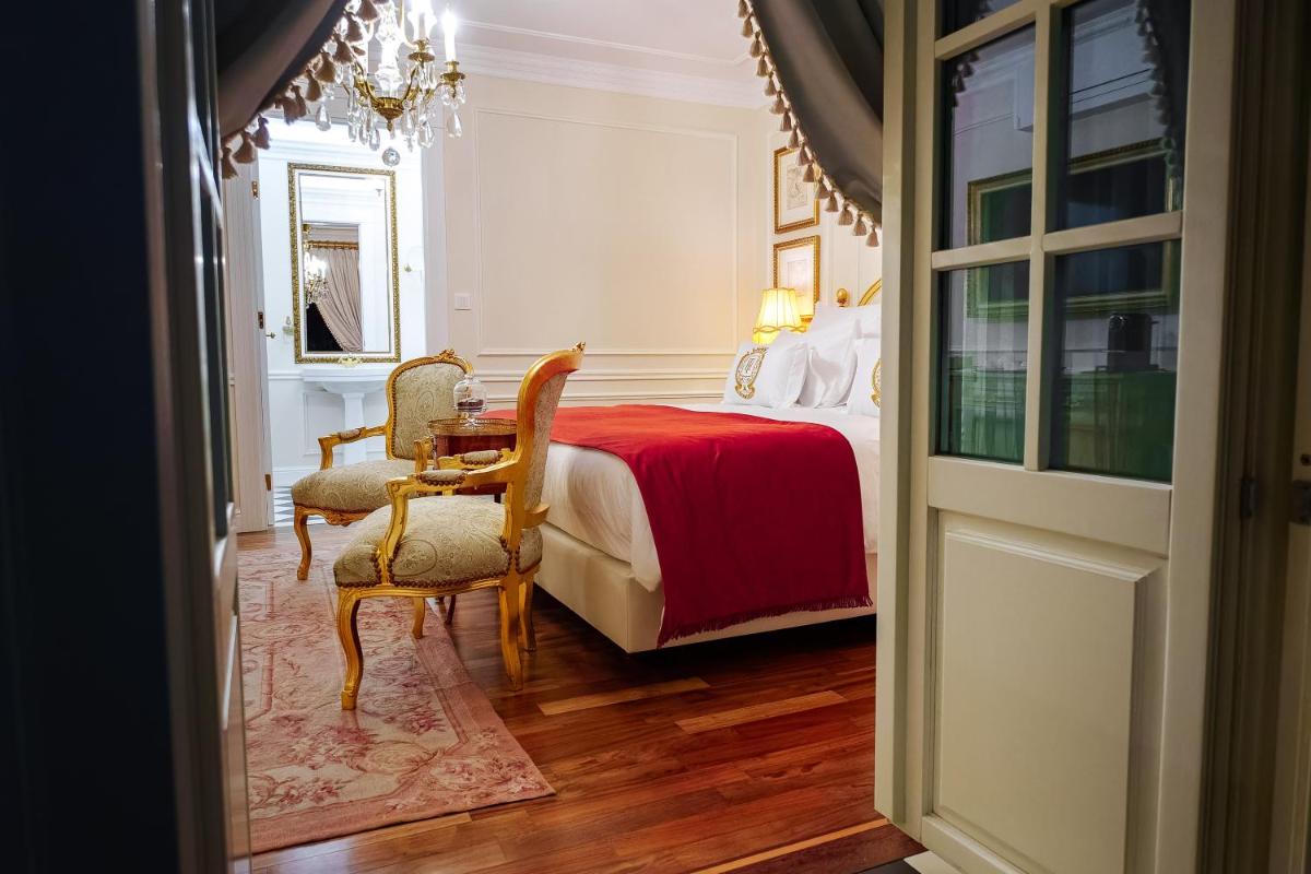 Uma cama ou camas num quarto em Boutique Hotel Teatro