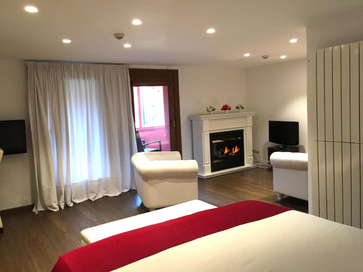 Cama o camas de una habitación en Hotel Del Lago