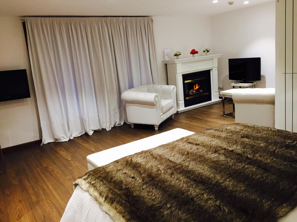 Cama o camas de una habitación en Hotel Del Lago
