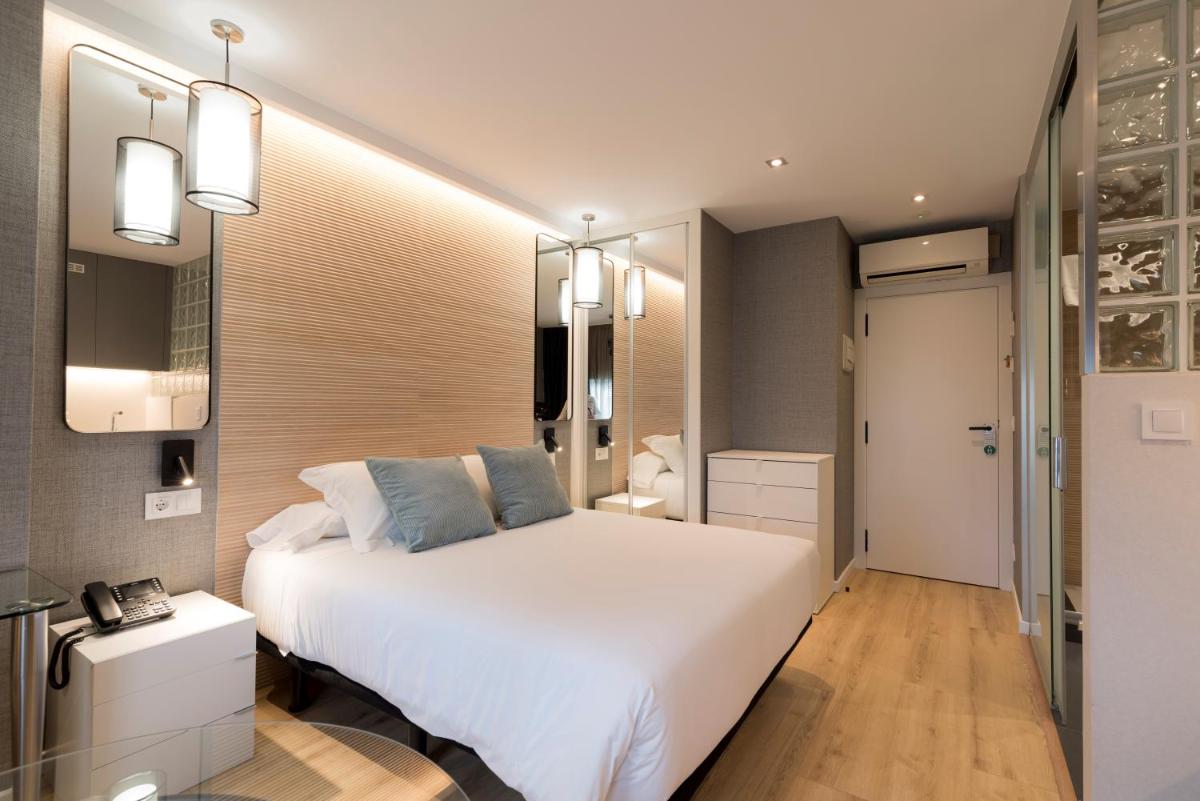 Cama o camas de una habitación en Hotel Avenida