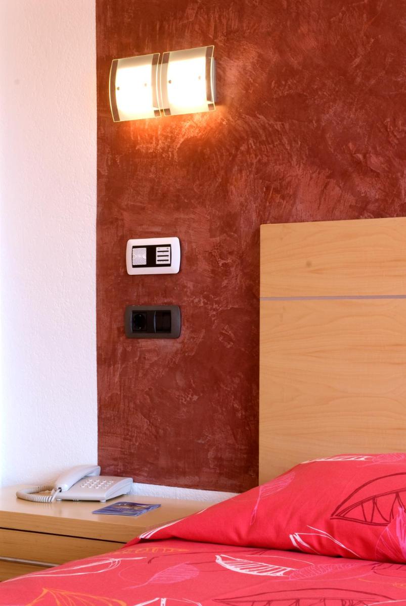 Cama o camas de una habitación en Hotel Capricho