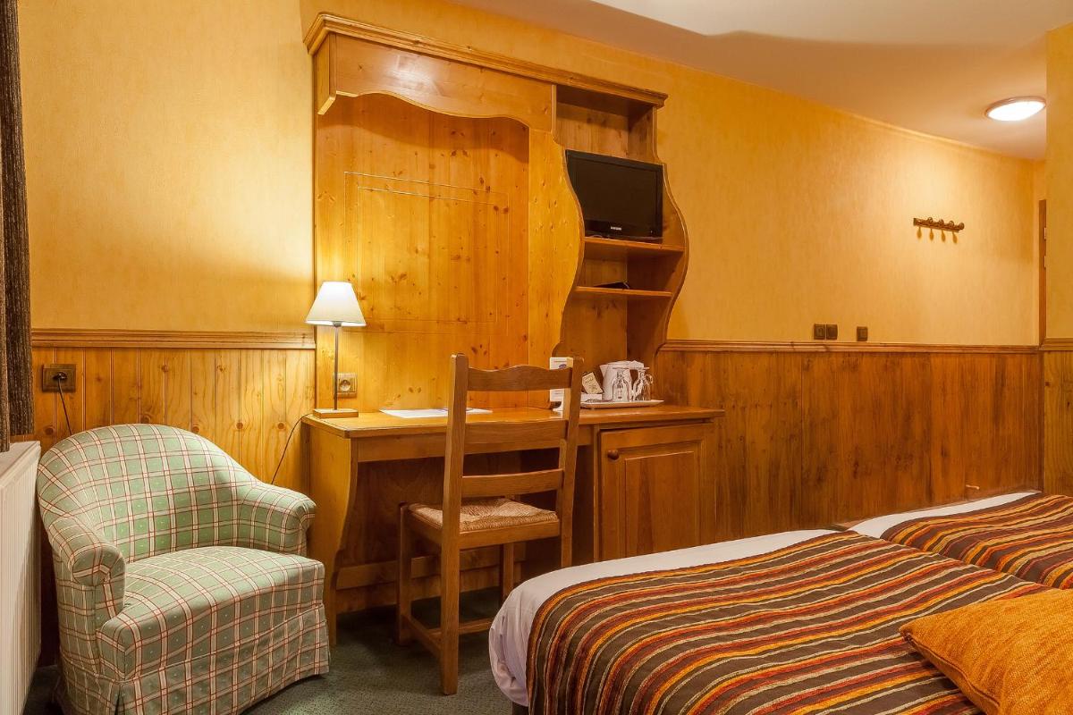 Un ou plusieurs lits dans un hébergement de l'établissement Hôtel Les Balcons Village