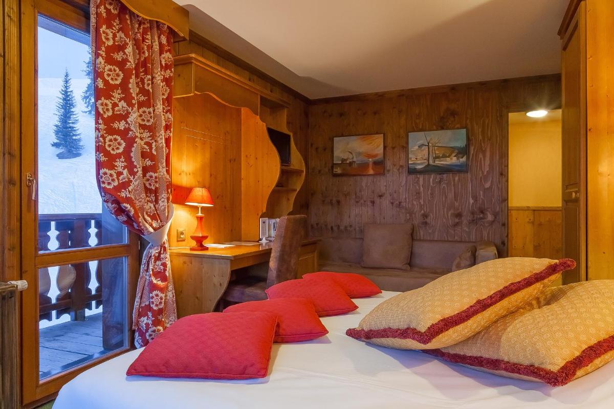 Un ou plusieurs lits dans un hébergement de l'établissement Hôtel Les Balcons Village