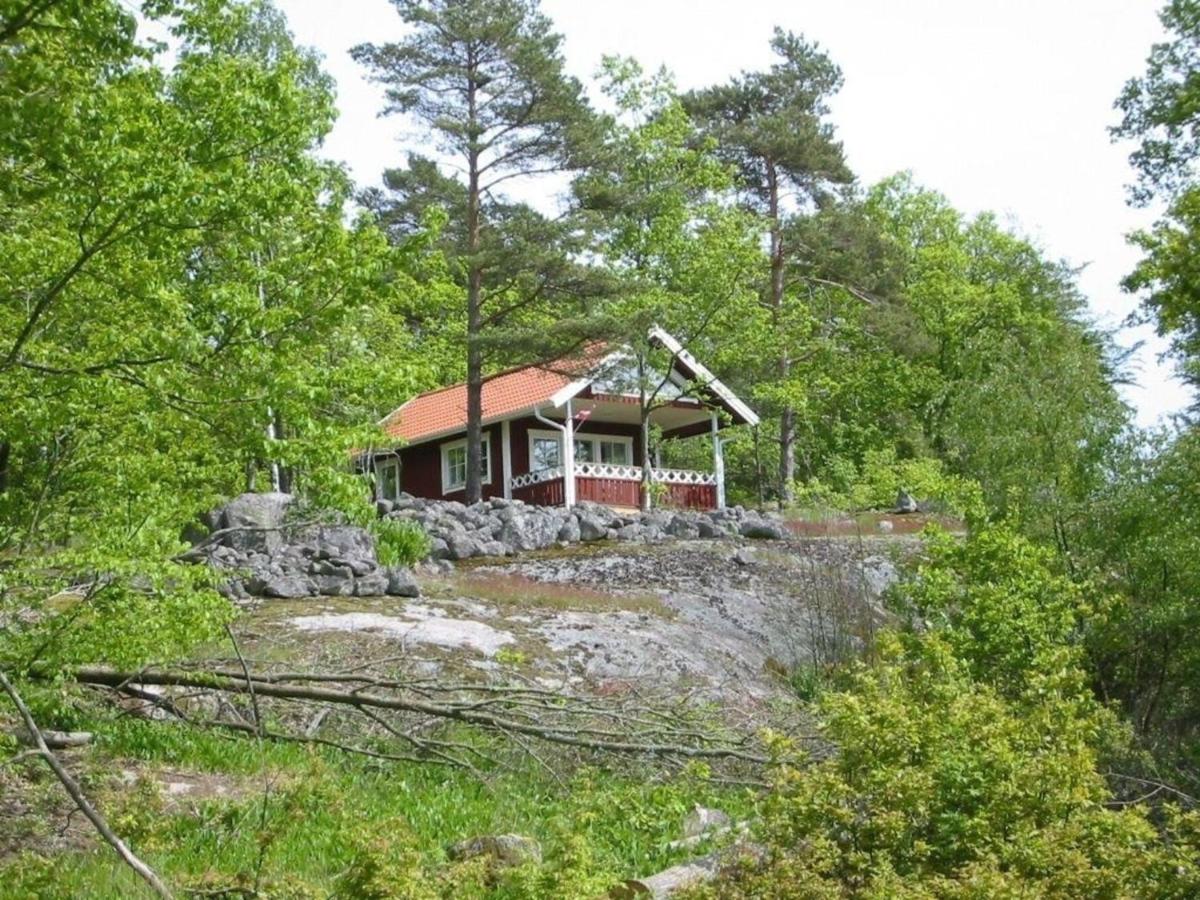 Holzhaus mit überdachter Terrasse - Housity