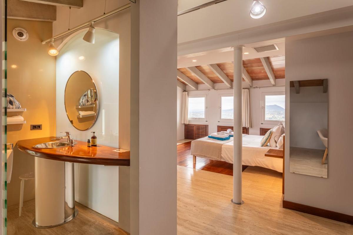 Cama o camas de una habitación en Can Cota Boutique - Turismo de interior