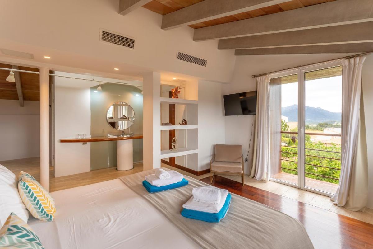 Cama o camas de una habitación en Can Cota Boutique - Turismo de interior