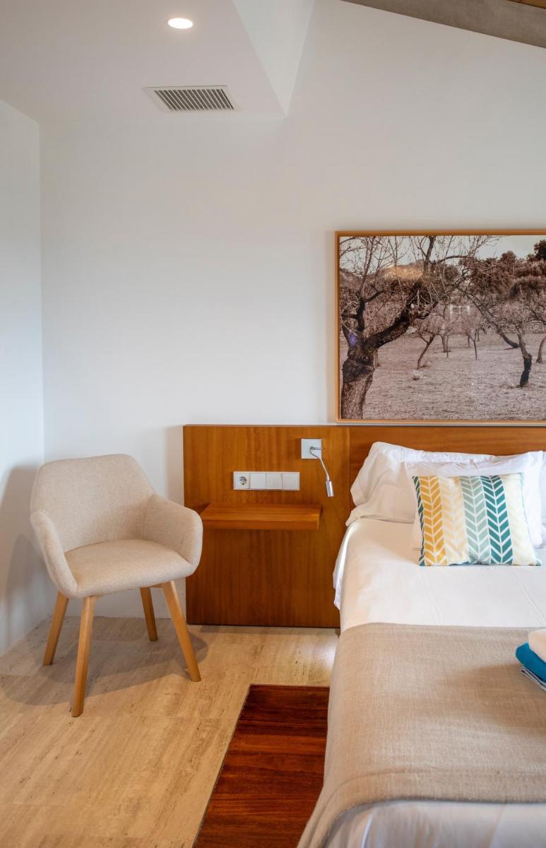 Cama o camas de una habitación en Can Cota Boutique - Turismo de interior