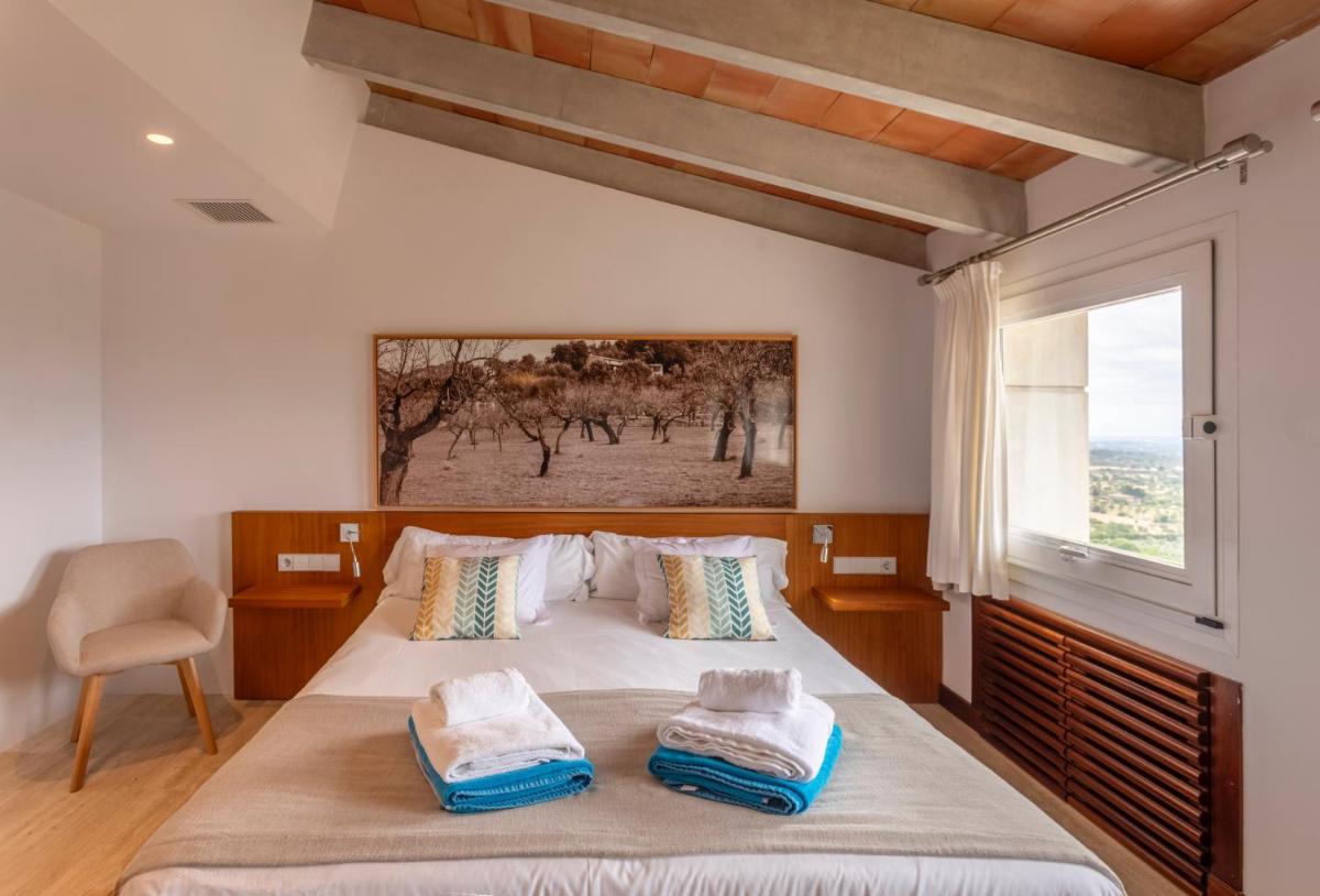 Cama o camas de una habitación en Can Cota Boutique - Turismo de interior