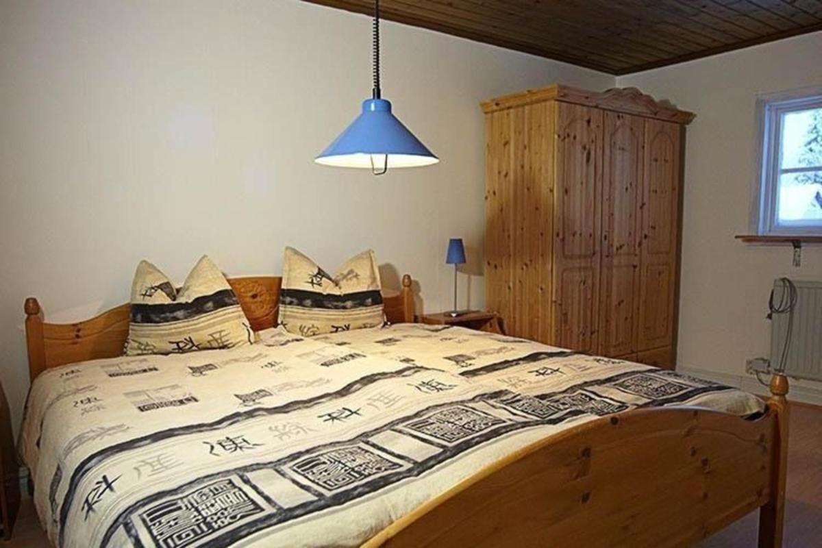 Ferienhaus am Wald mit Kaminofen und Veranda - Housity