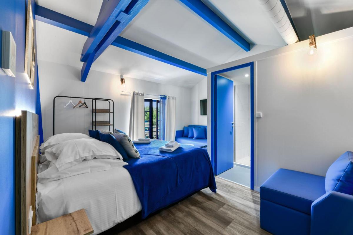 Un ou plusieurs lits dans un hébergement de l'établissement Logis L'Auberge de Larressingle