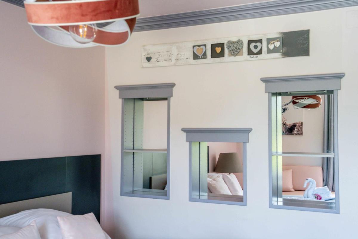Un ou plusieurs lits dans un hébergement de l'établissement Logis L'Auberge de Larressingle