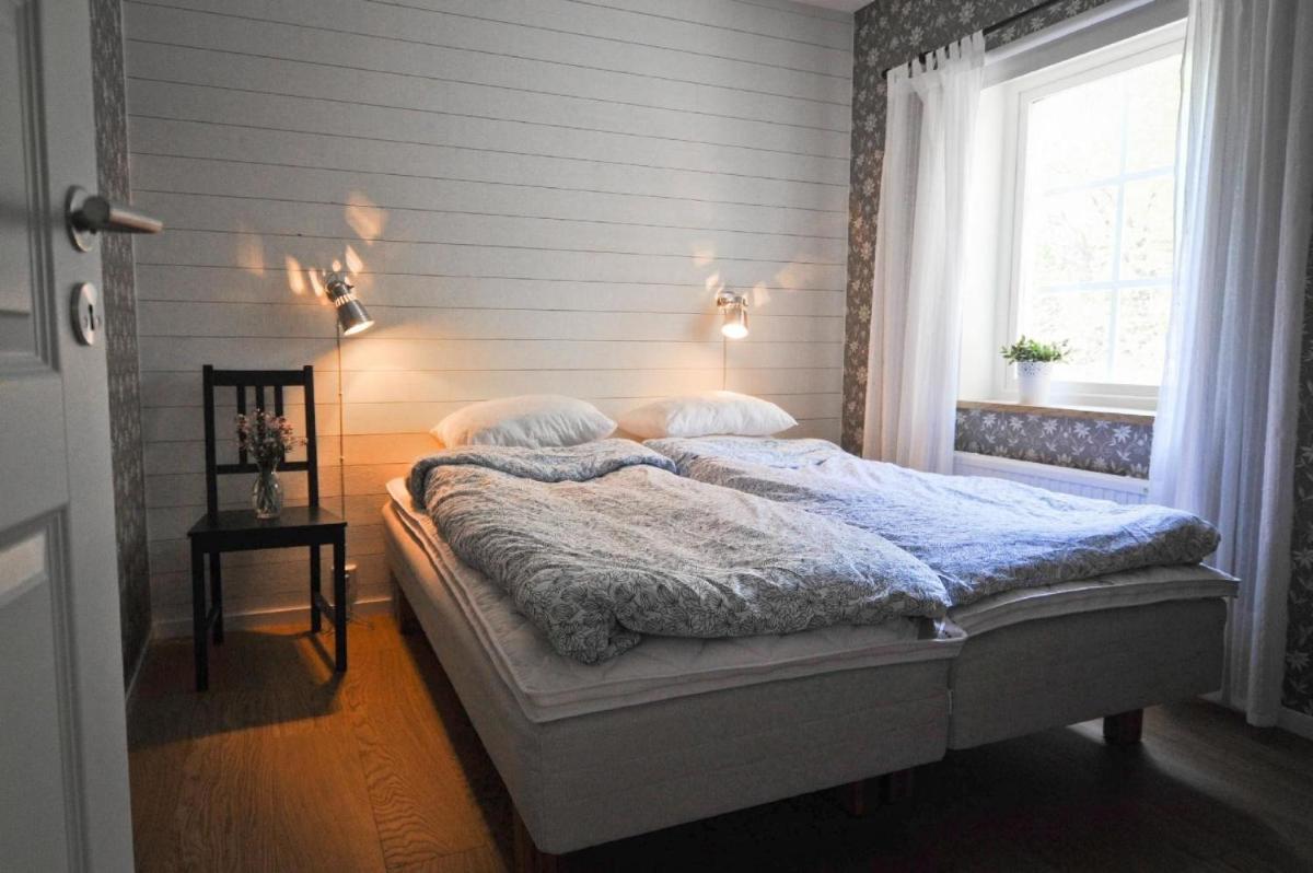 Direkt am See gelegenes Ferienhaus - Housity