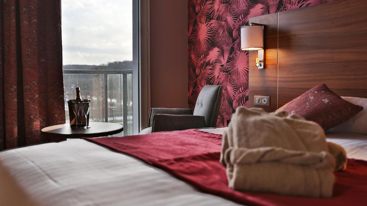 Un ou plusieurs lits dans un hébergement de l'établissement Best Western Eden SPA