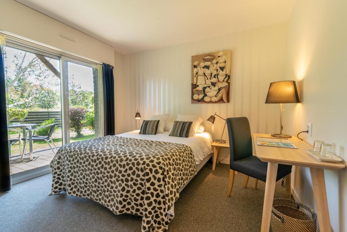 Un ou plusieurs lits dans un hébergement de l'établissement Carnac Lodge Hotel & Spa