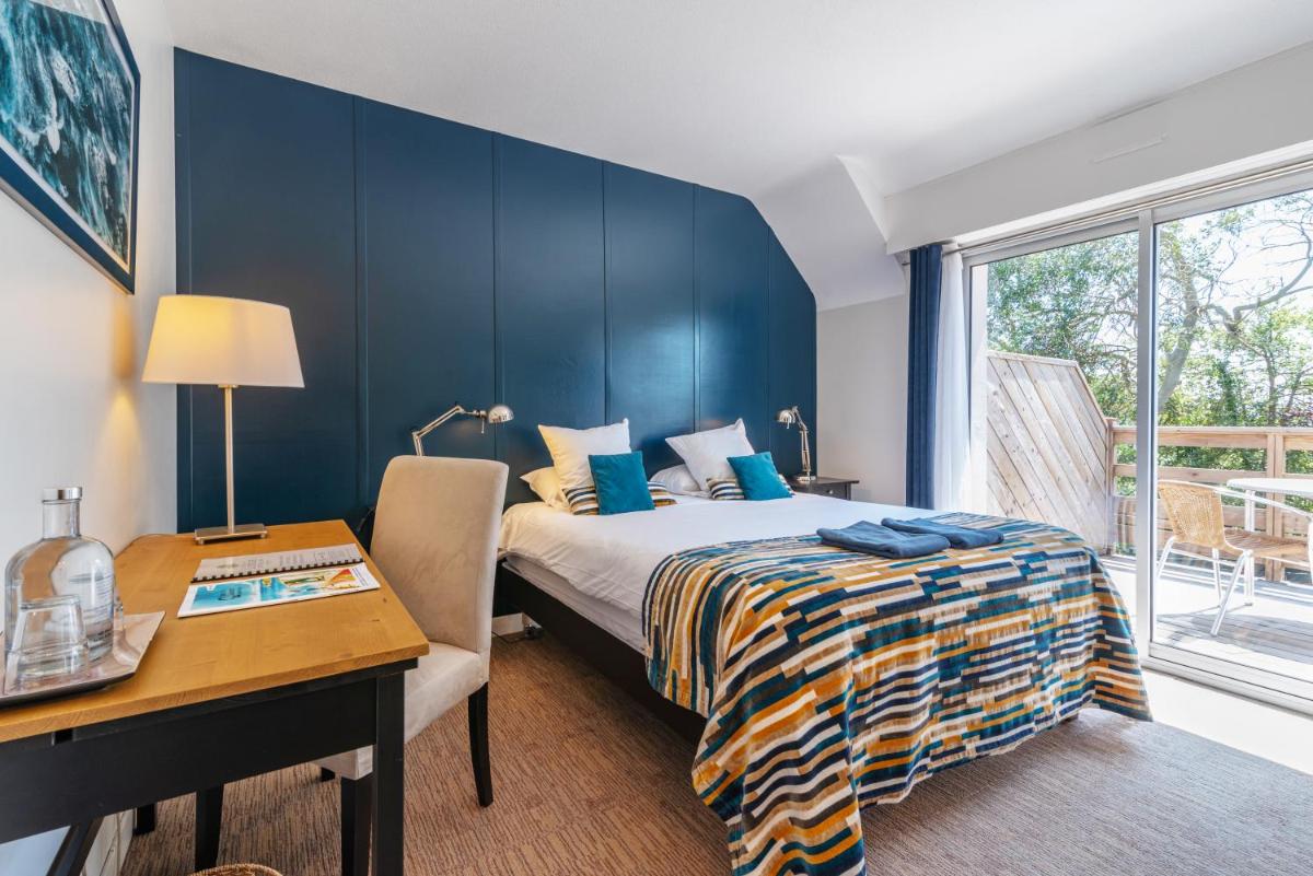 Un ou plusieurs lits dans un hébergement de l'établissement Carnac Lodge Hotel & Spa