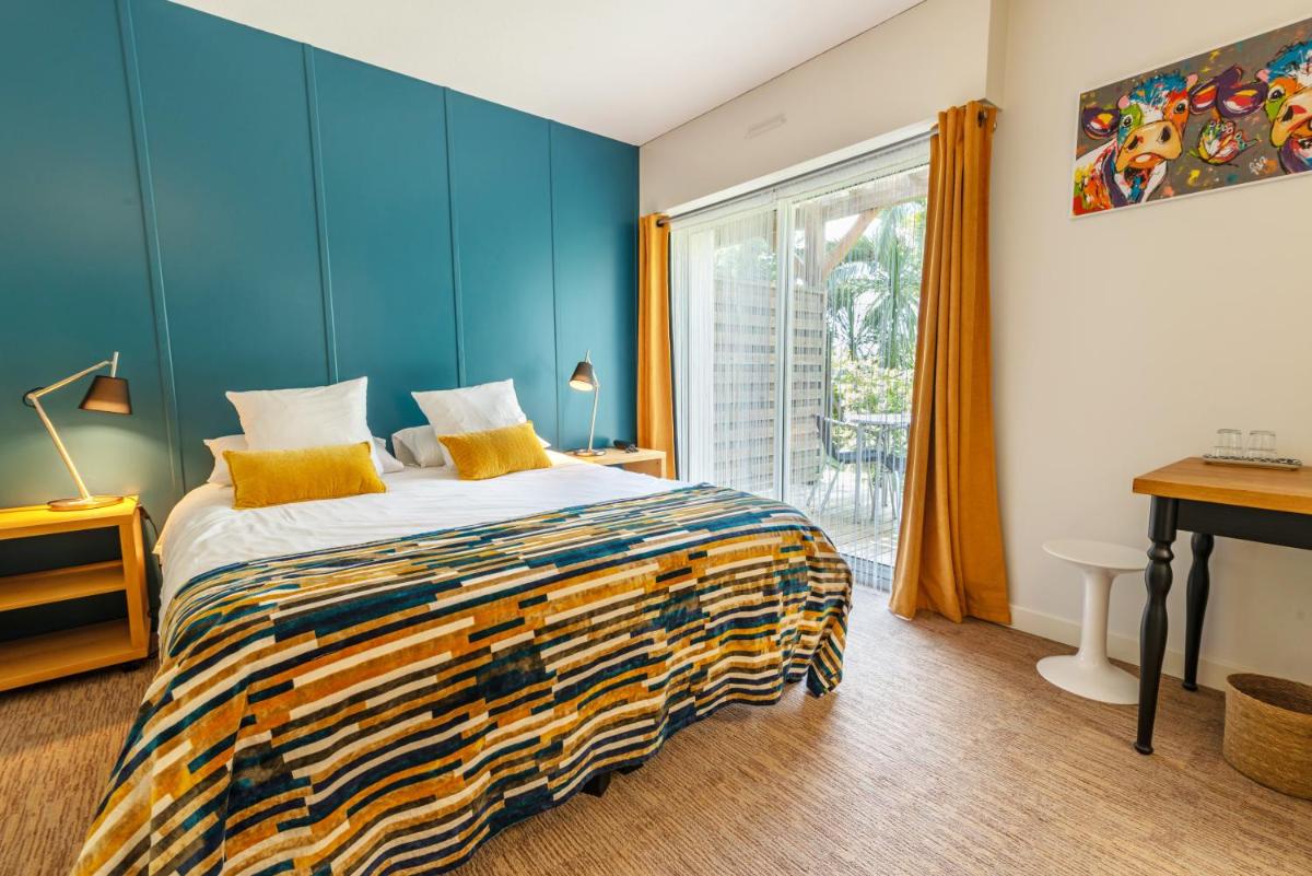 Un ou plusieurs lits dans un hébergement de l'établissement Carnac Lodge Hotel & Spa