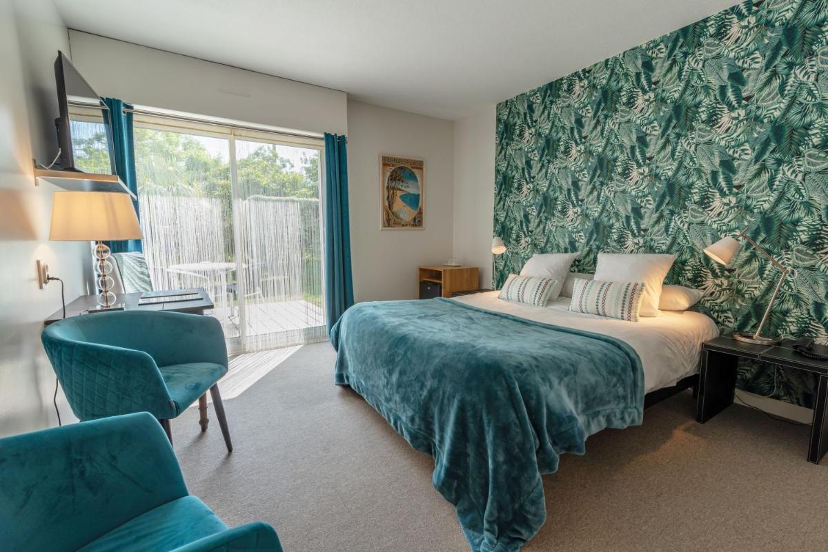 Un ou plusieurs lits dans un hébergement de l'établissement Carnac Lodge Hotel & Spa