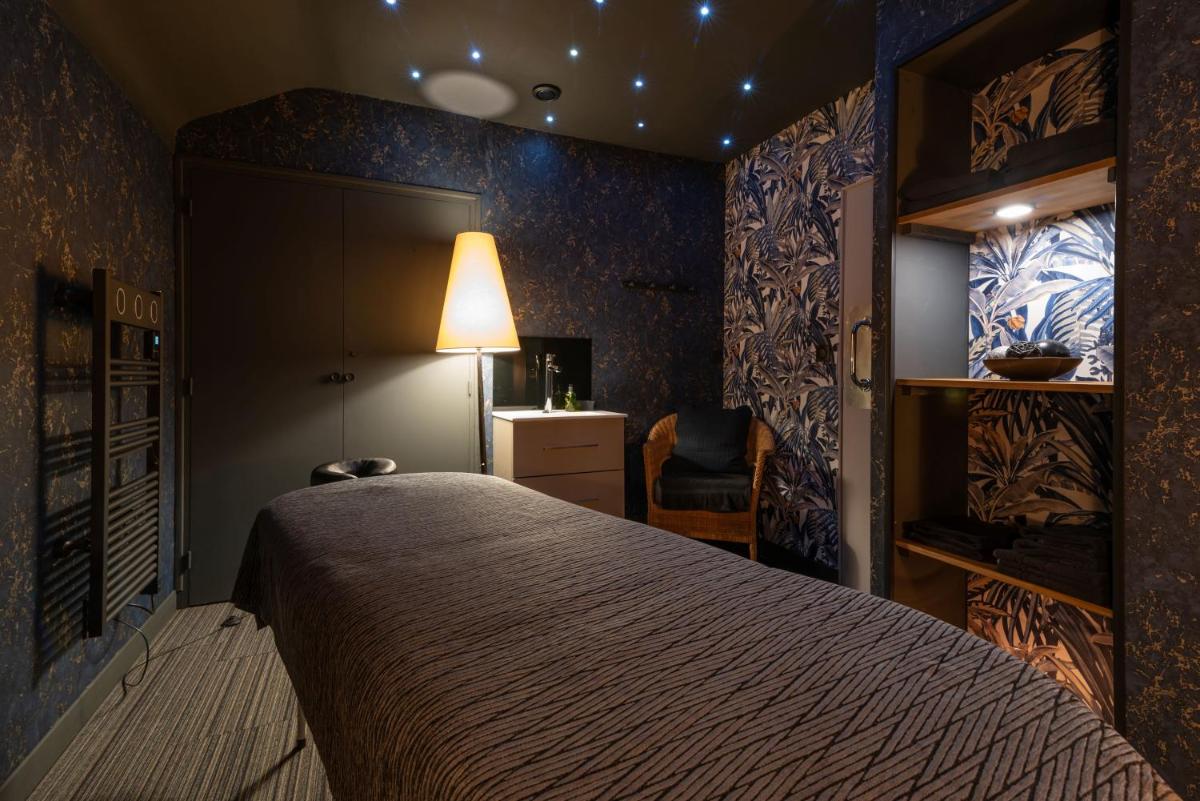 Un ou plusieurs lits dans un hébergement de l'établissement Carnac Lodge Hotel & Spa
