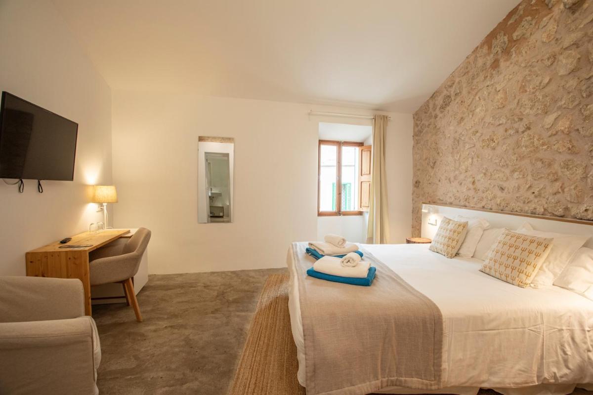 Cama o camas de una habitación en Can Cota Boutique - Turismo de interior