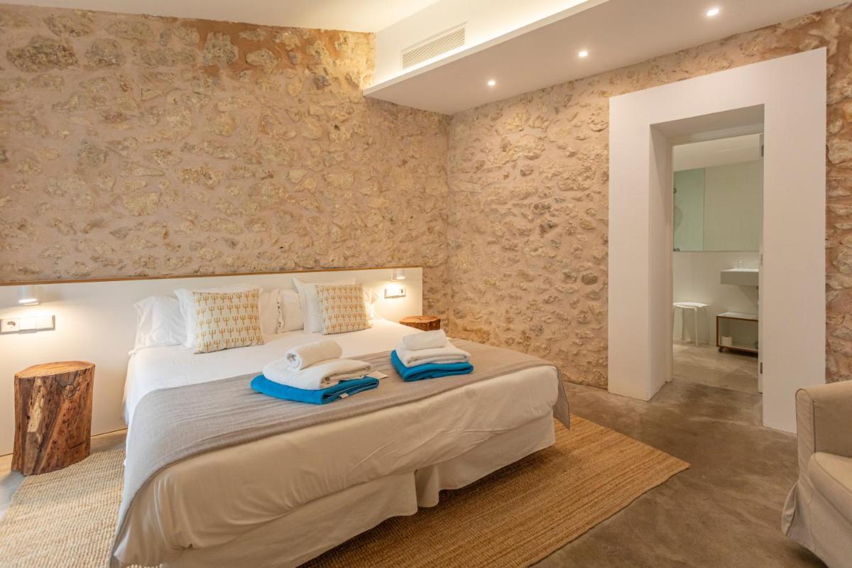 Cama o camas de una habitación en Can Cota Boutique - Turismo de interior
