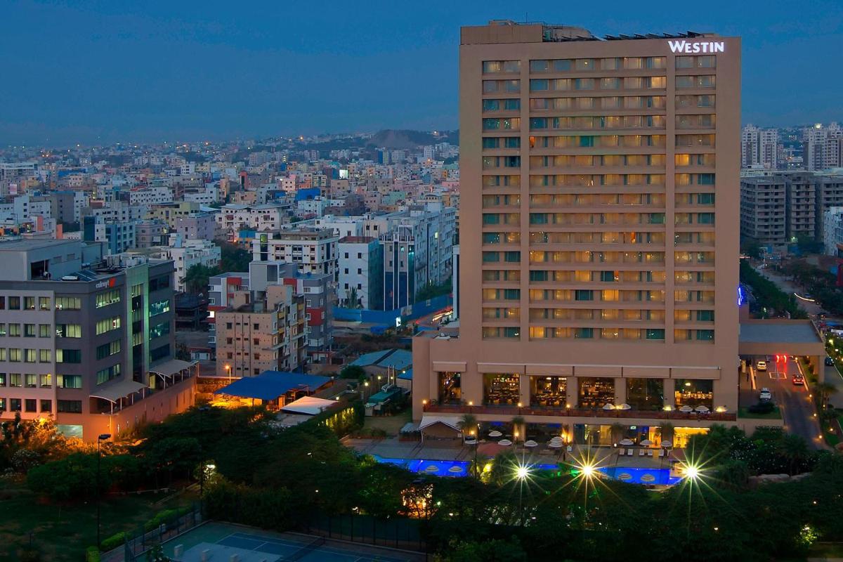 a view of a building in a city at night at The Westin Hyderabad Mindspace in Hyderabad