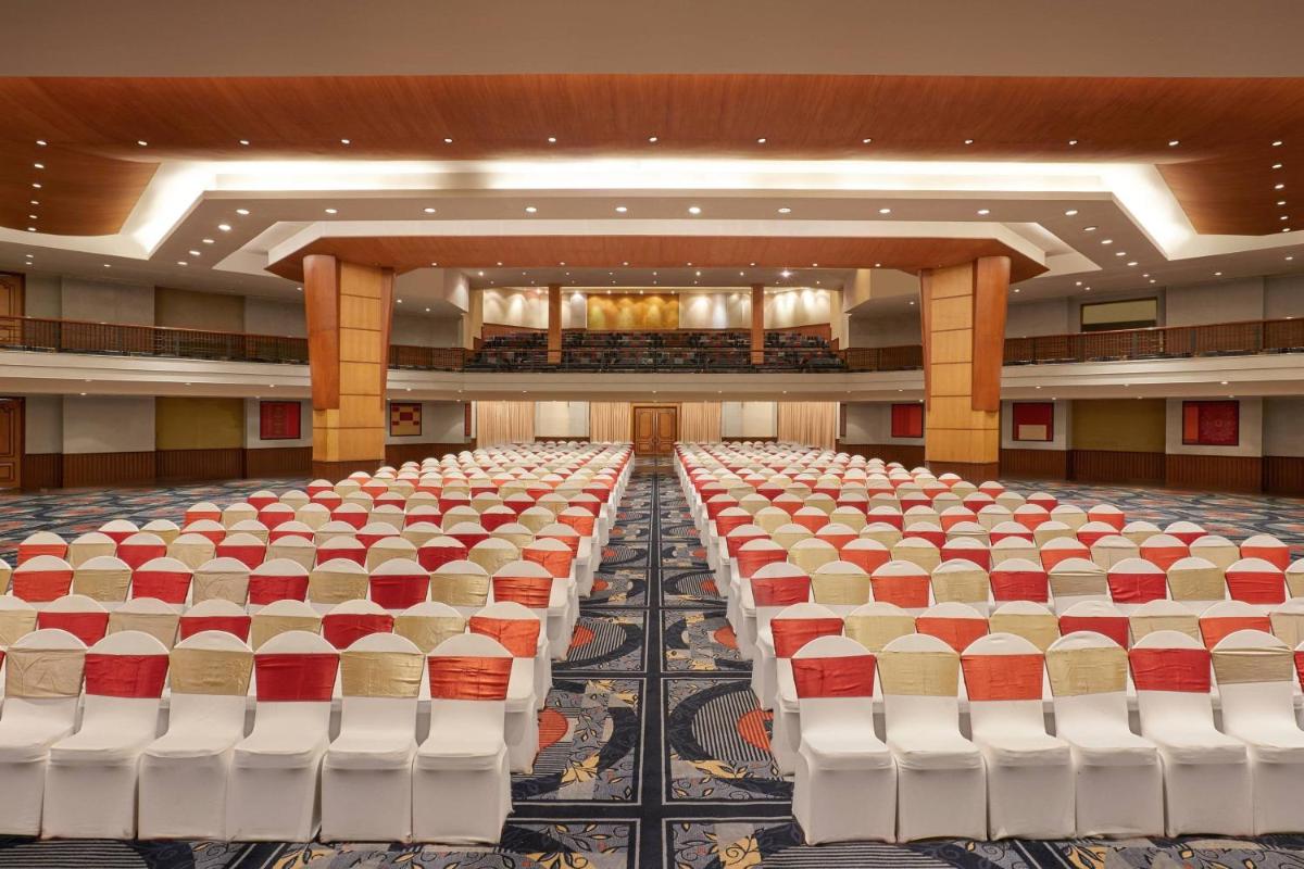 an empty banquet hall with rows of chairs at Hyderabad Marriott Hotel & Convention Centre in Hyderabad
