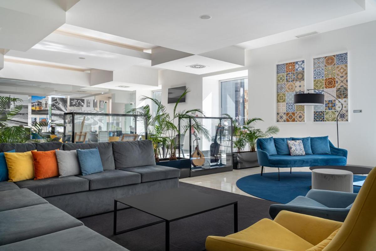Uma área de estar em Jupiter Lisboa Hotel - Rooftop & Spa
