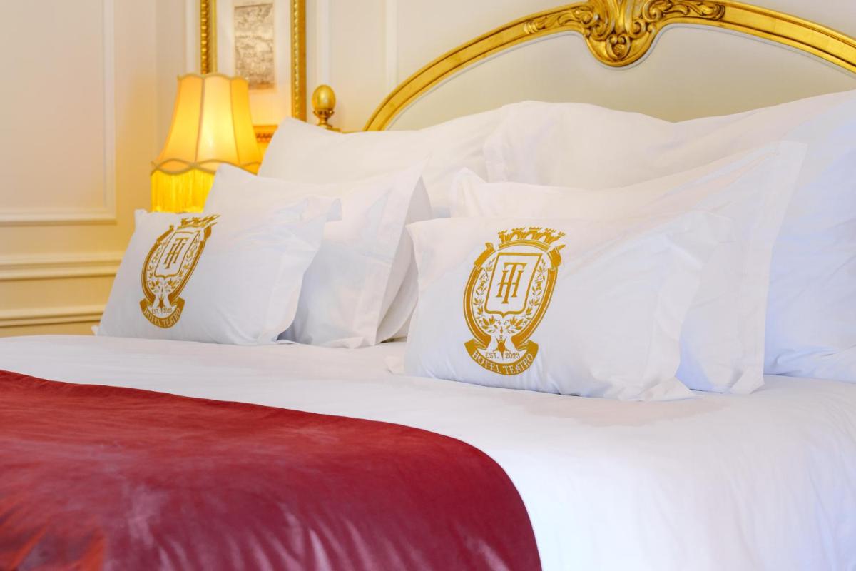Uma cama ou camas num quarto em Boutique Hotel Teatro