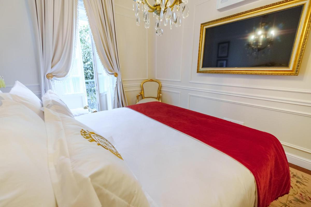 Uma cama ou camas num quarto em Boutique Hotel Teatro