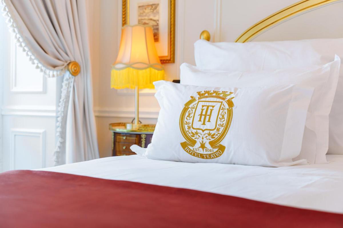 Uma cama ou camas num quarto em Boutique Hotel Teatro