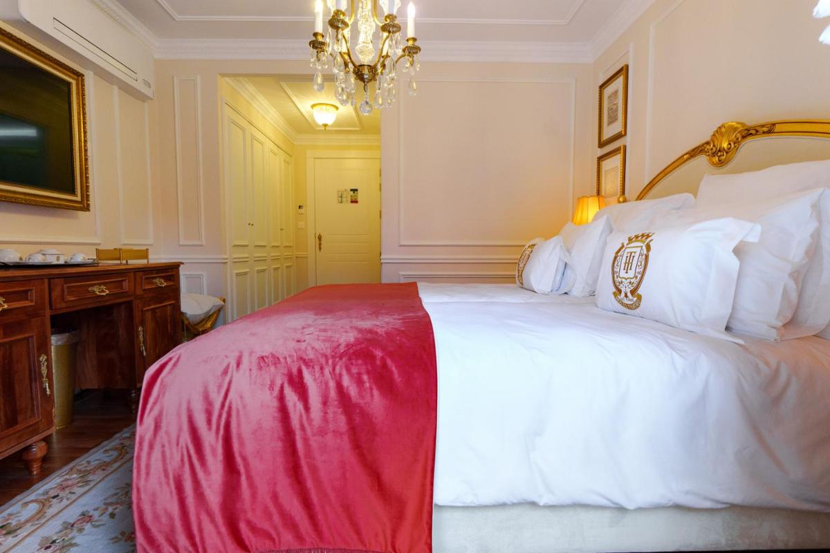 Uma cama ou camas num quarto em Boutique Hotel Teatro